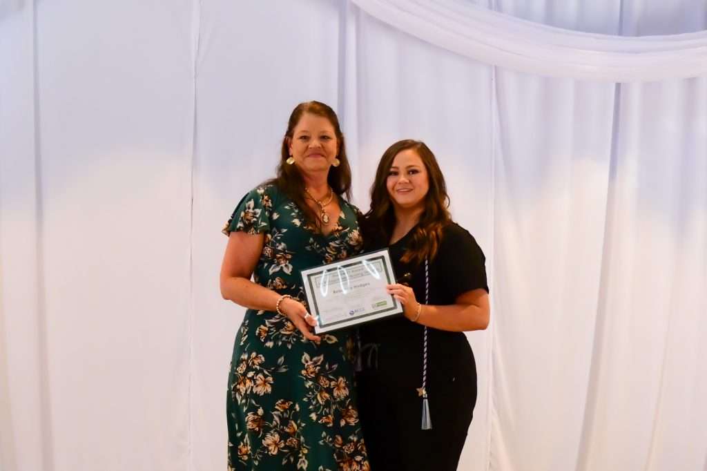 2 people with a certificate