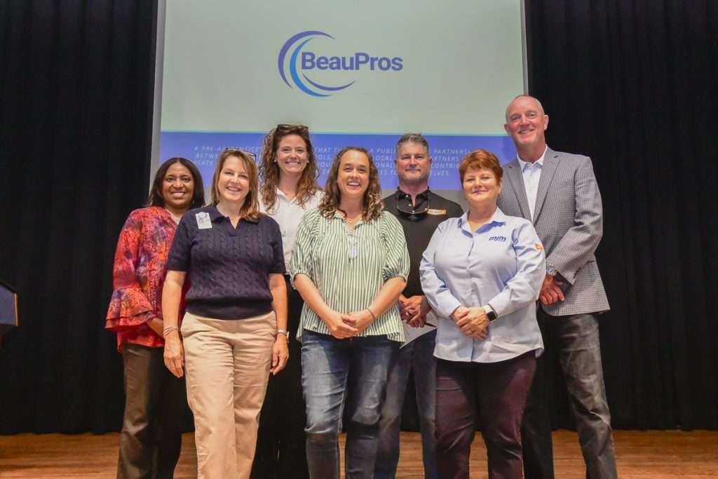 group of people in front of text BeauPros