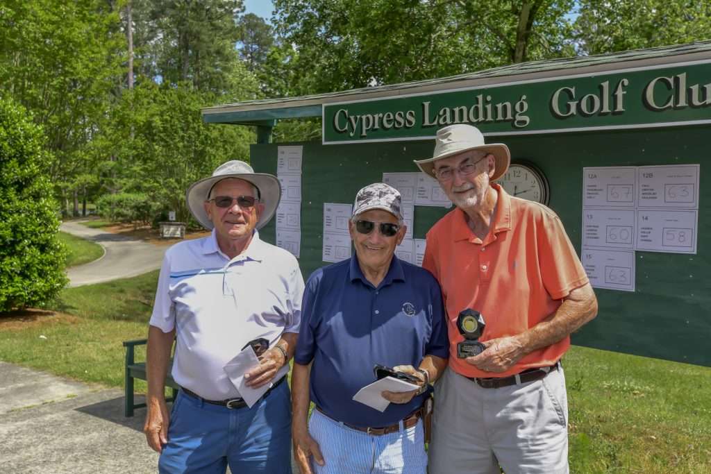 three people with awards