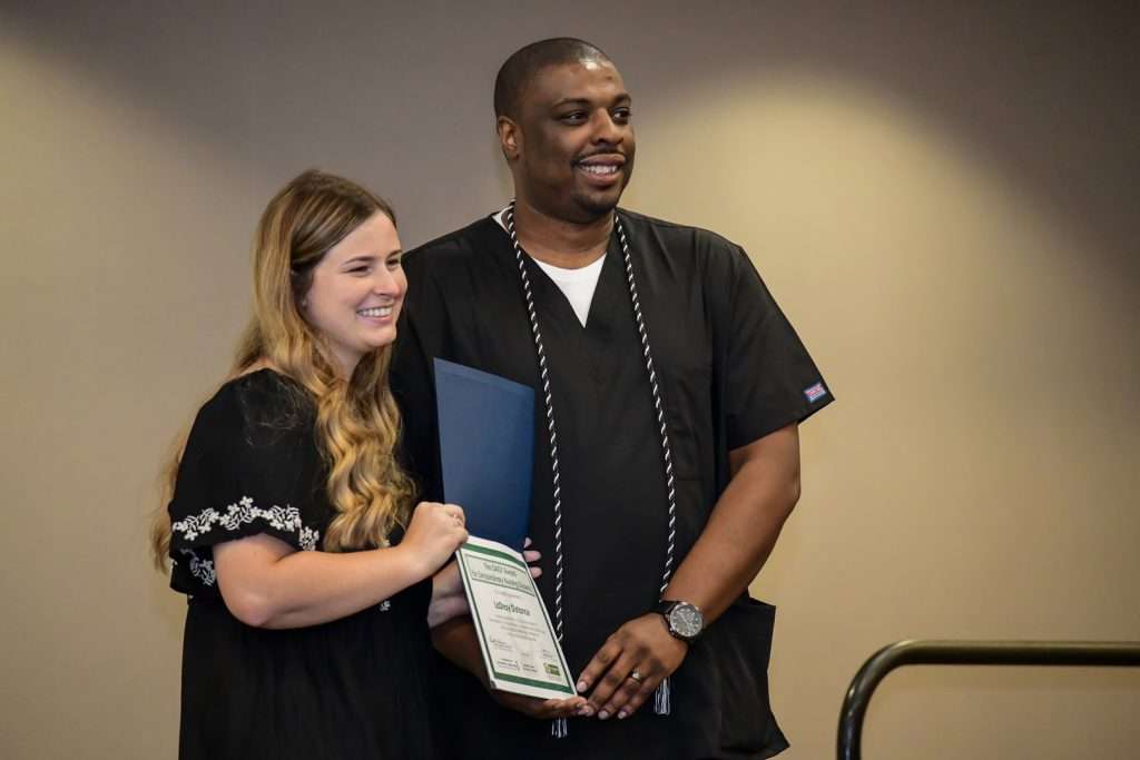Student receiving certificate