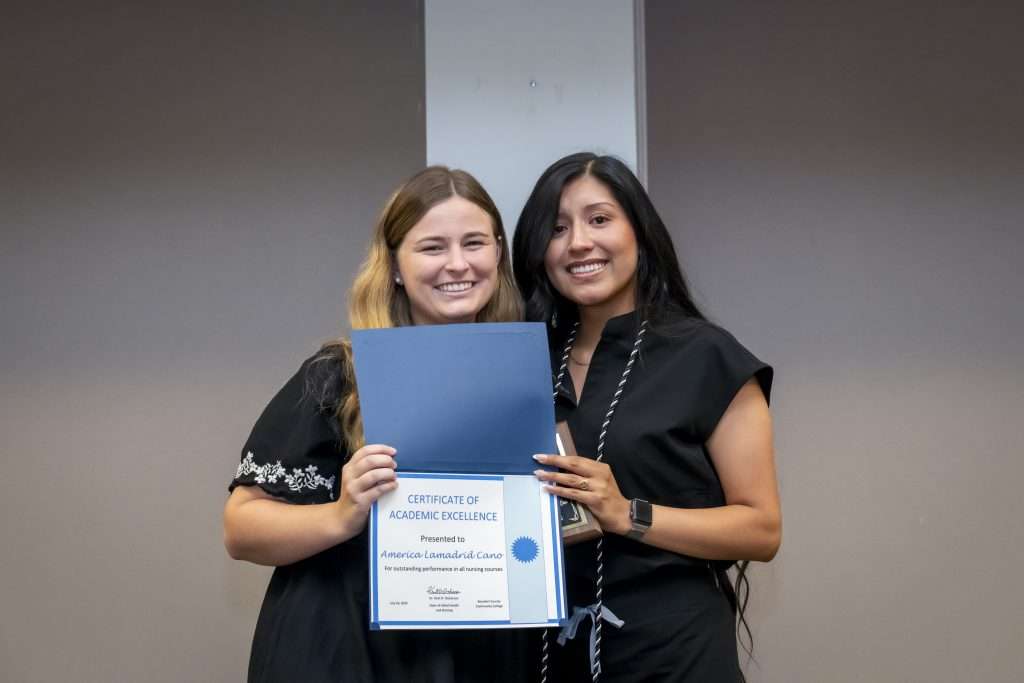 two people with an award