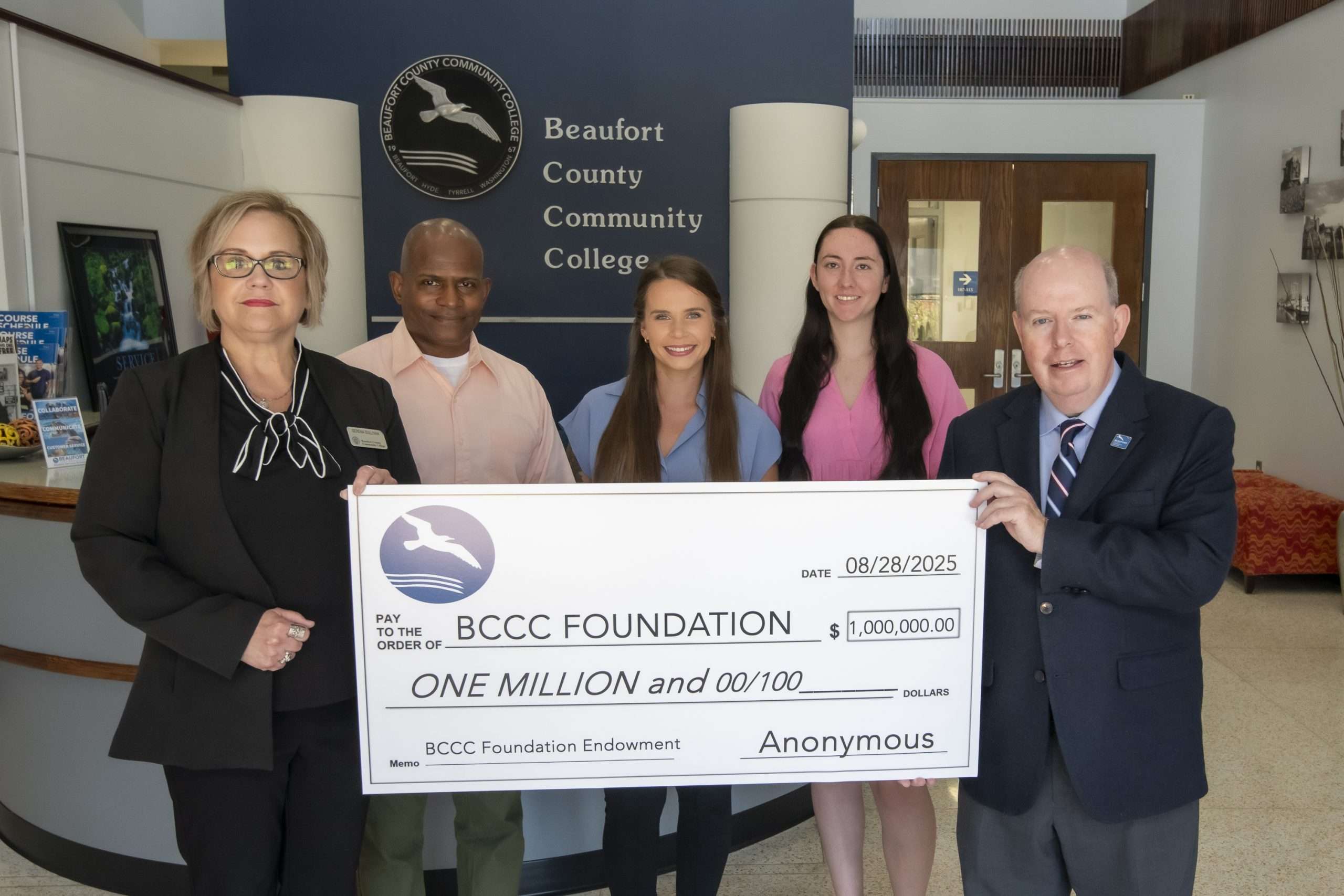 group with a large check one million dollars
