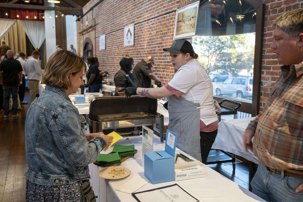 People in line with food