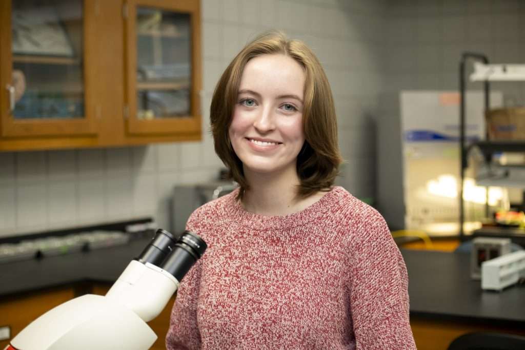 a person with a microscope