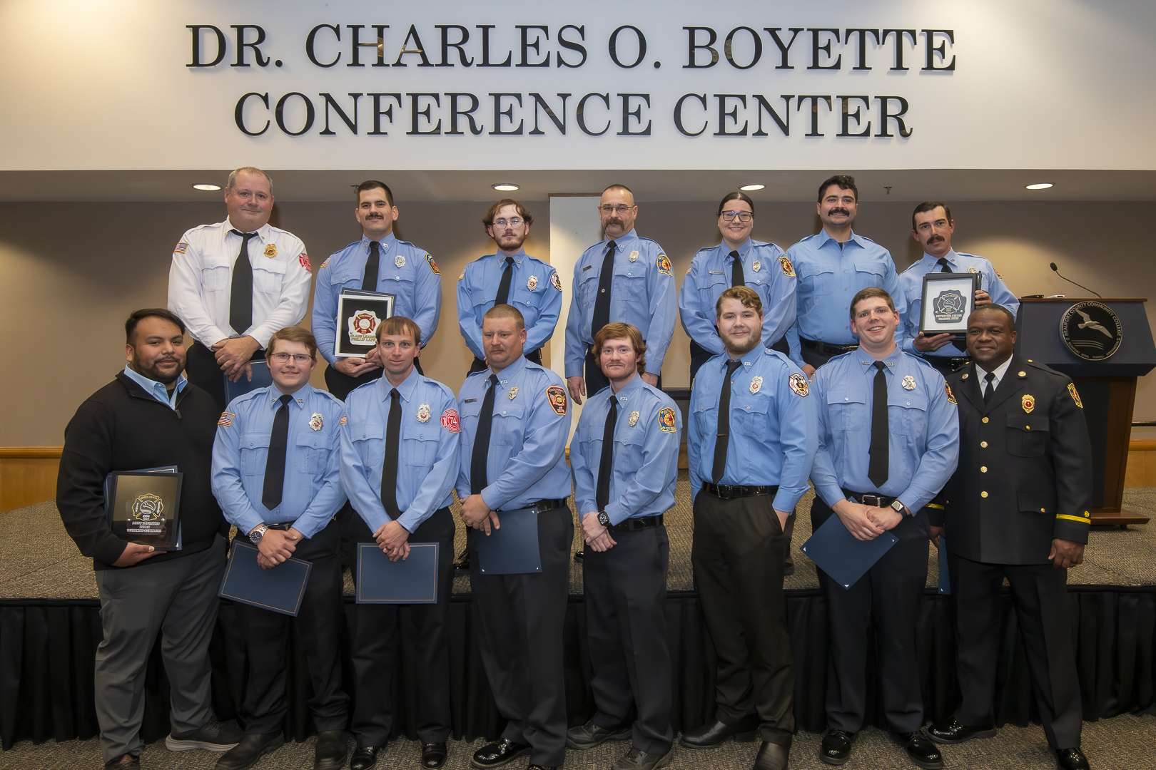 large group of dress uniformed firefighters