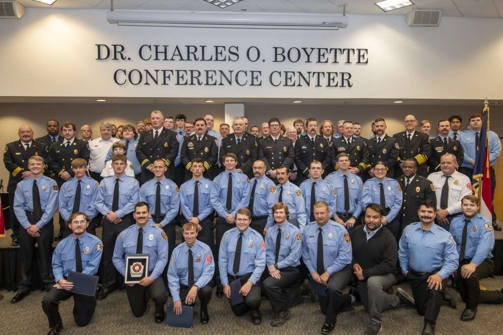 very large group of firefighters in dress uniform