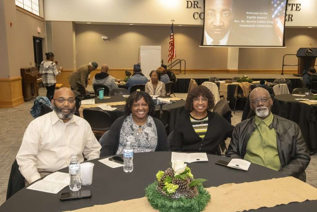 four people at decorative table
