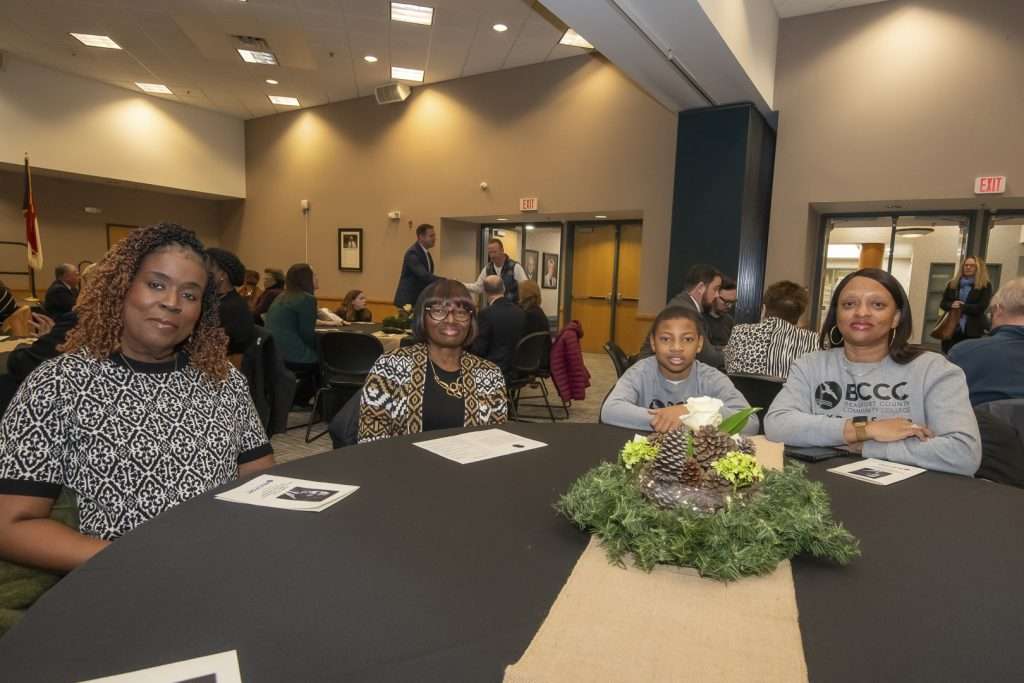 four people in a room