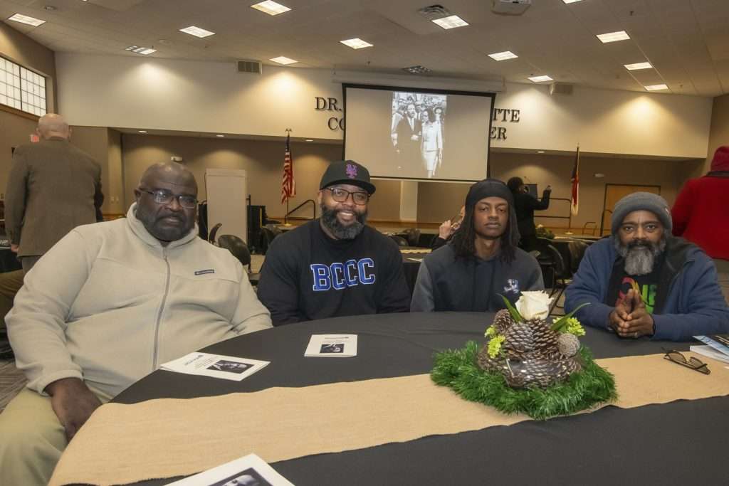 four people at a celebration