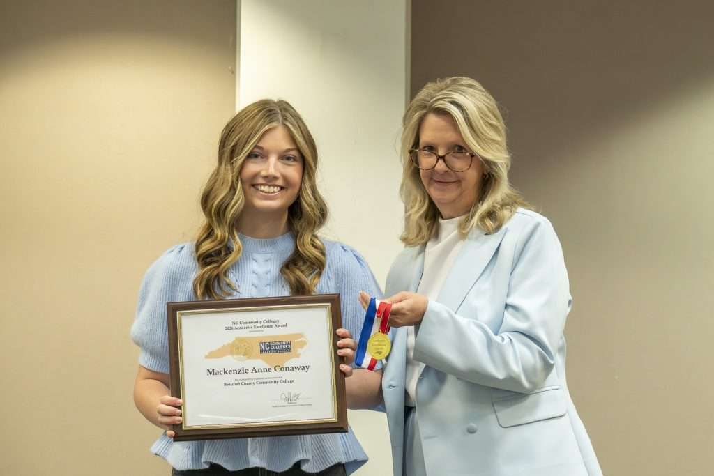 two people with an award