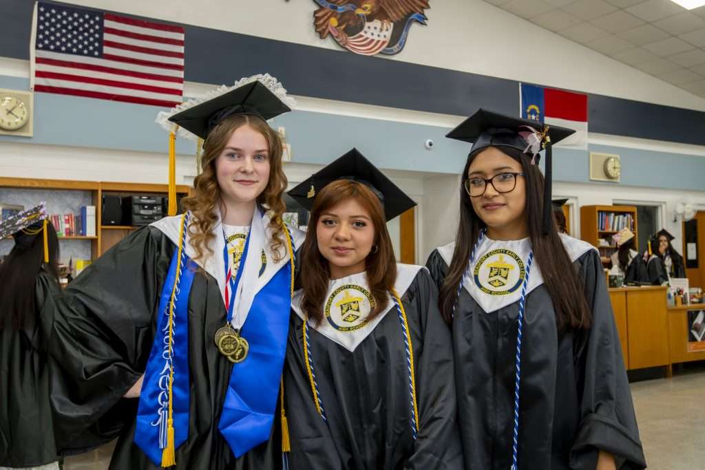 three people at graduation