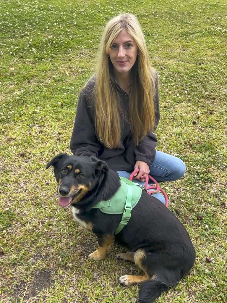 person with dog on the groud
