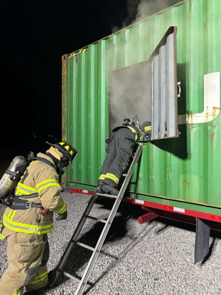 Firefight on ladder in trining structure