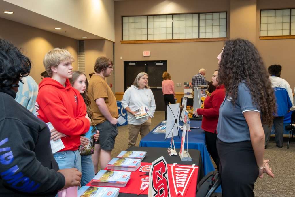 student talking with a university rep